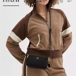 - NWT Coach Polished Pebble Leather Kira Crossbody